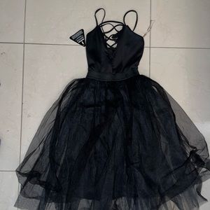 Black dress new with tags lace up front with tool bottom